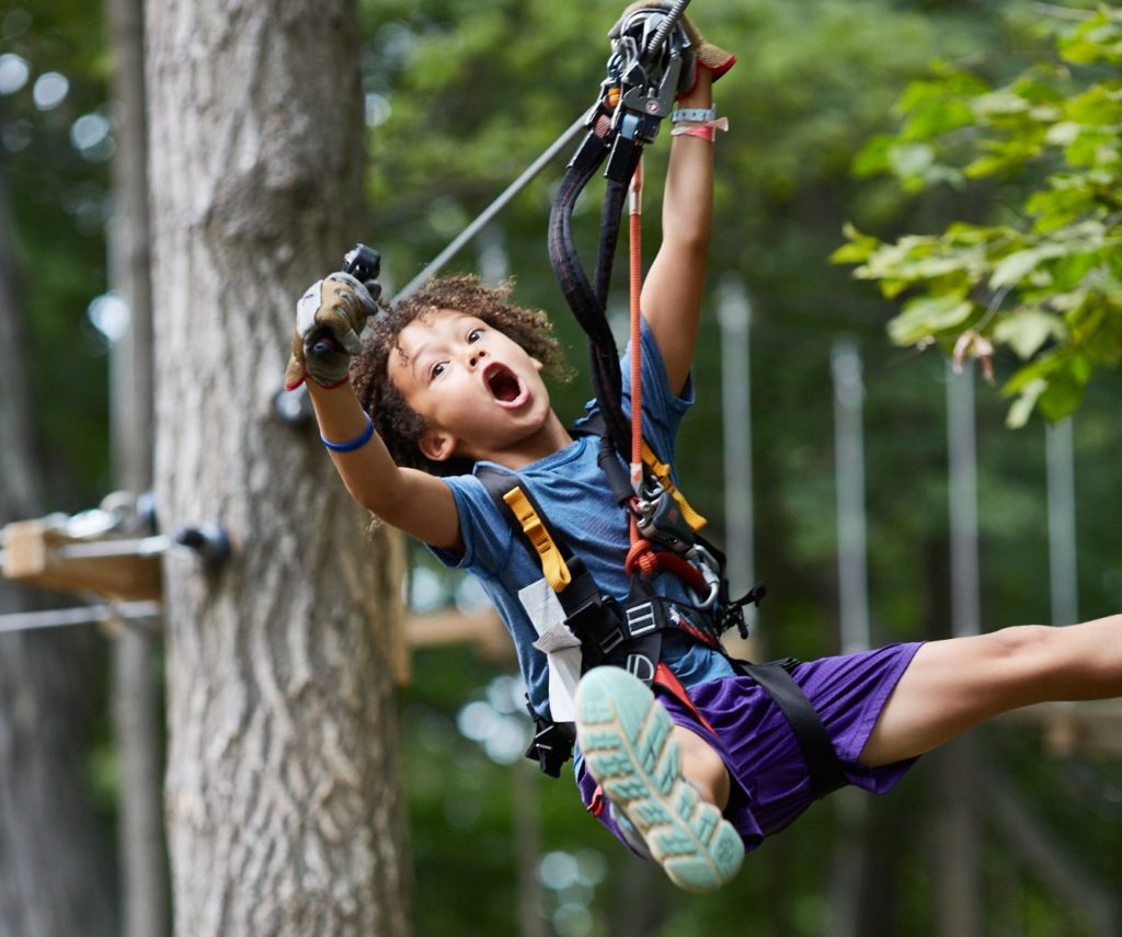 kid ziplining in Boundless Adventures