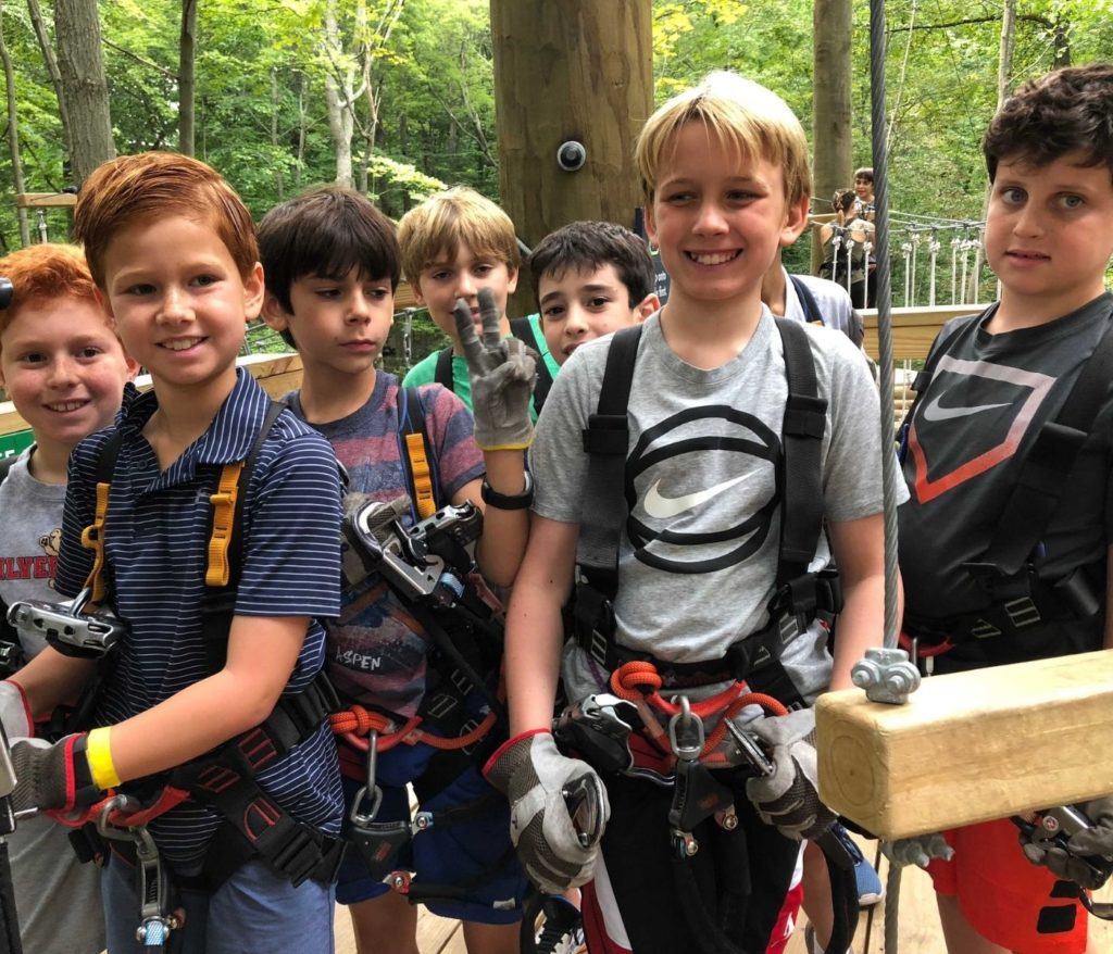 group of boys on main platform at our high ropes course