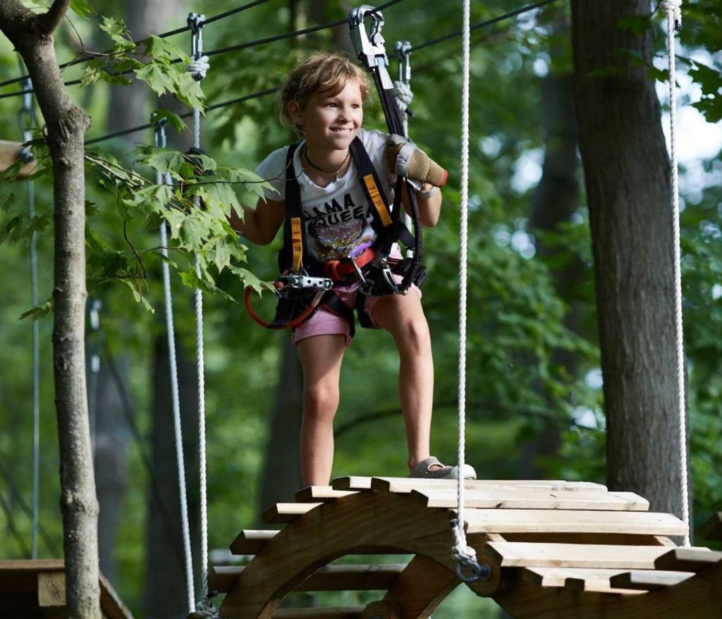 girl on wobbly ladder in Kenosha Wisconsin aerial adventure course
