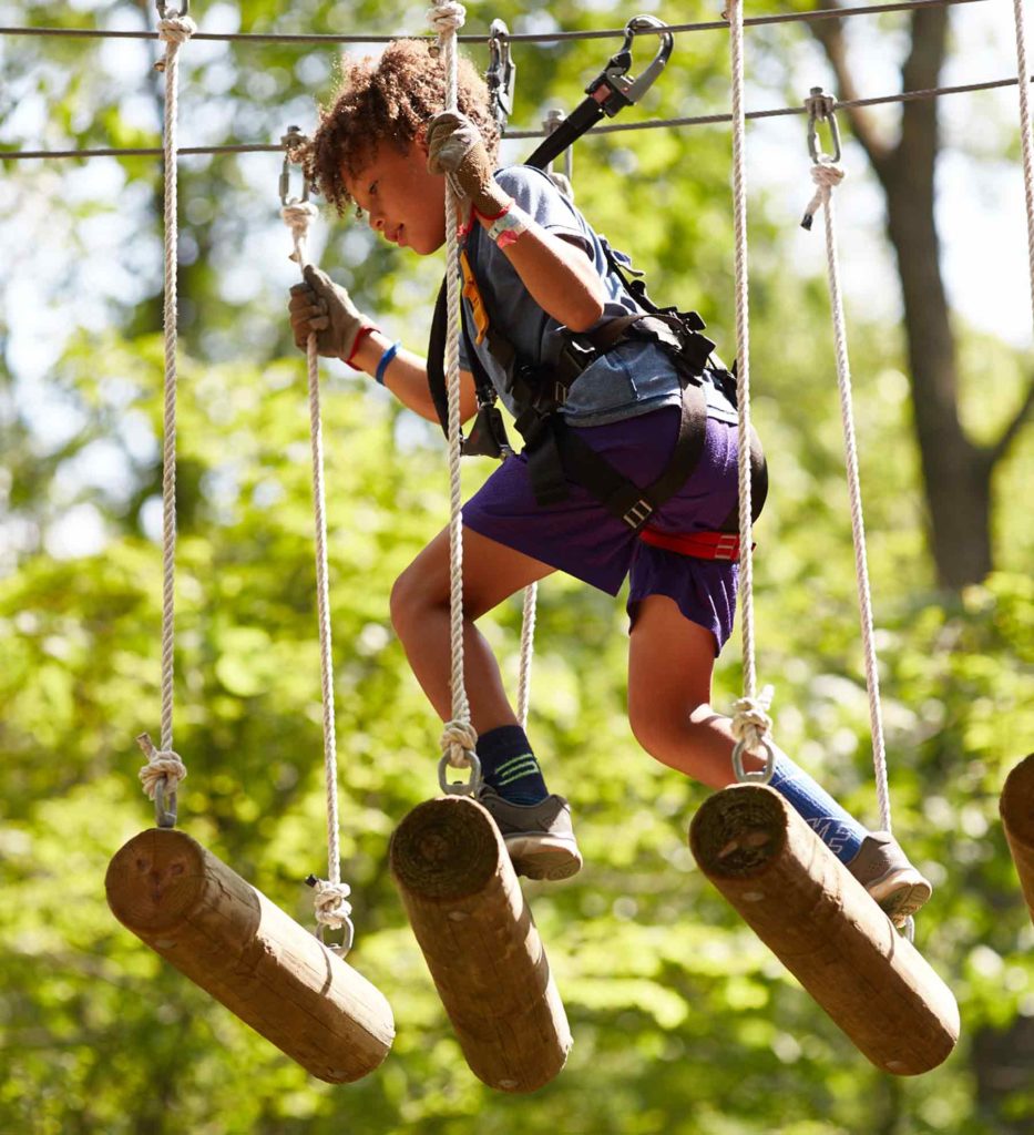 Boy on a High Ropes Obstacle at Boundless Adventures in Berlin Mass