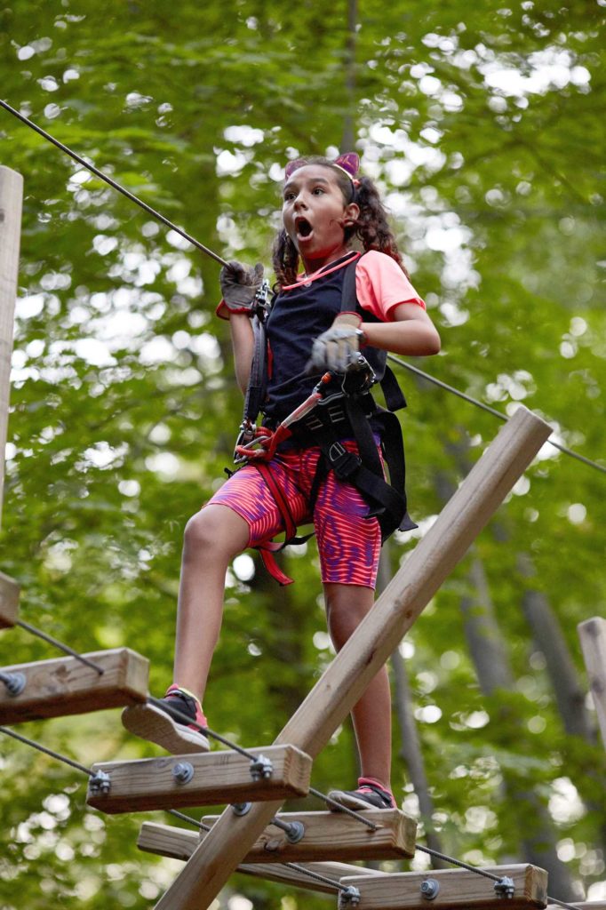 excited girl on ropes course in Purchase NY
