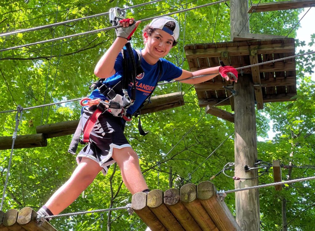 boy on high ropes course