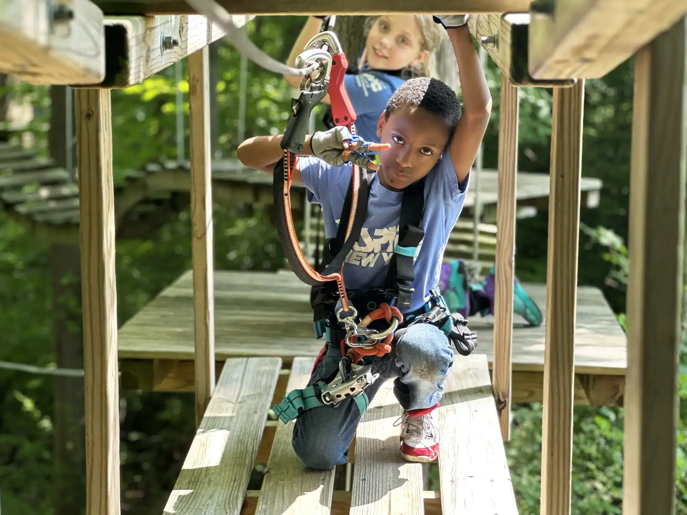 A boy on the beginner level difficulty at Boundless Adventure park