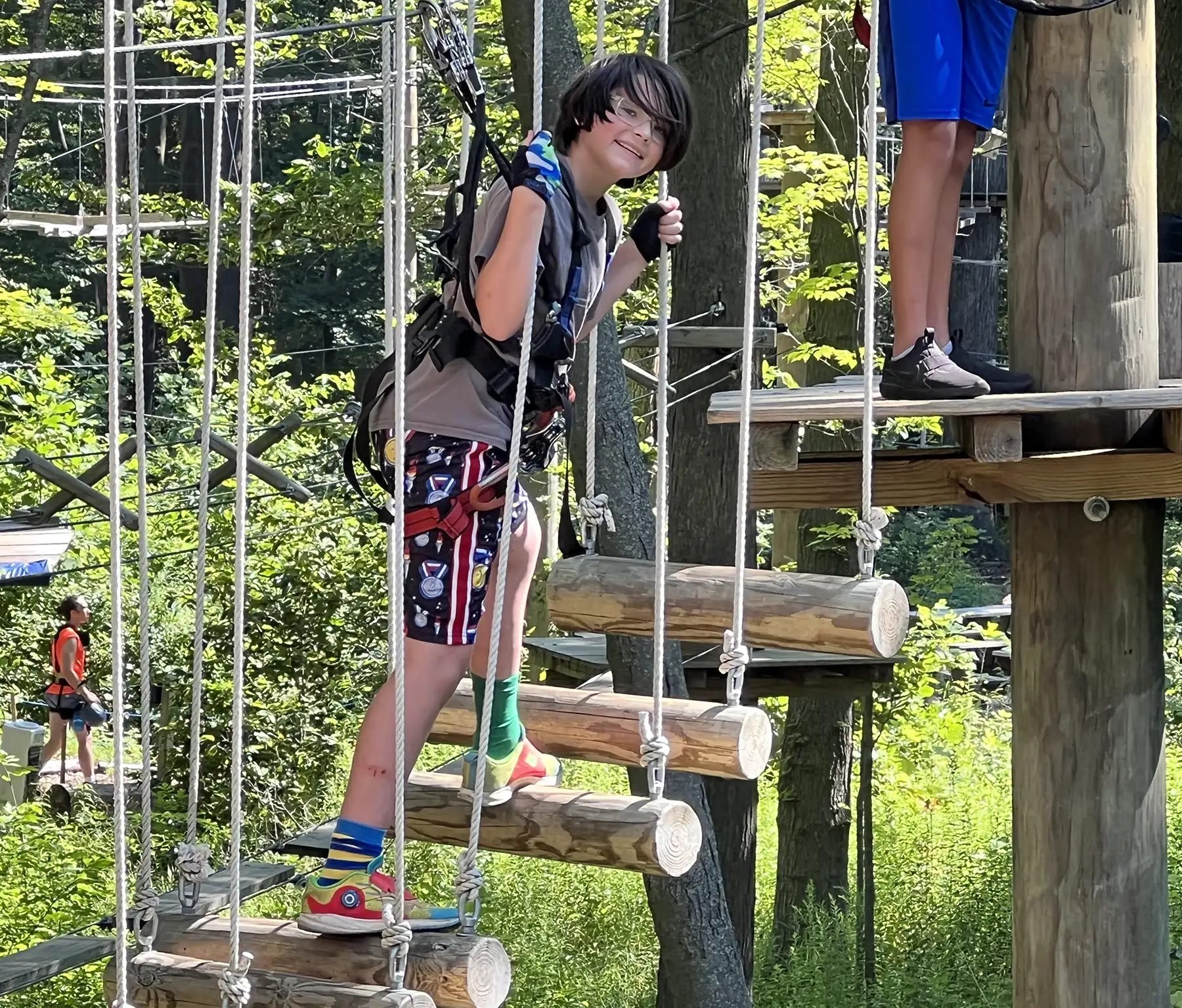 Boy on wooden obstacle course